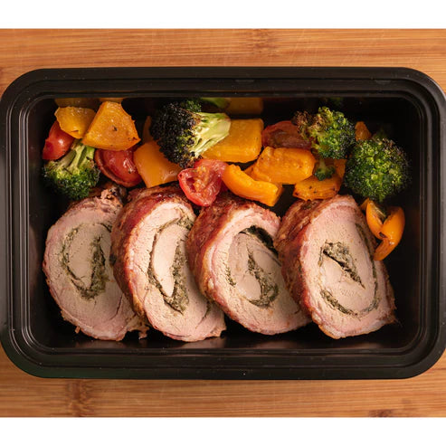 Bacon Wrapped Stuffed Pork Tenderloin with Sautéed Vegetables